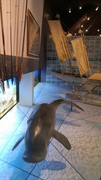 The mother and baby dugong below an amazing Alick Tipoti link-cut print representative of the sea hunting tradition in the Torres Strait. 